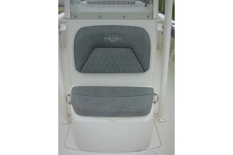 Slide: The Image of 2020 Stingray 216 CC boat seat with gray cushioned backrest and seat. - 15