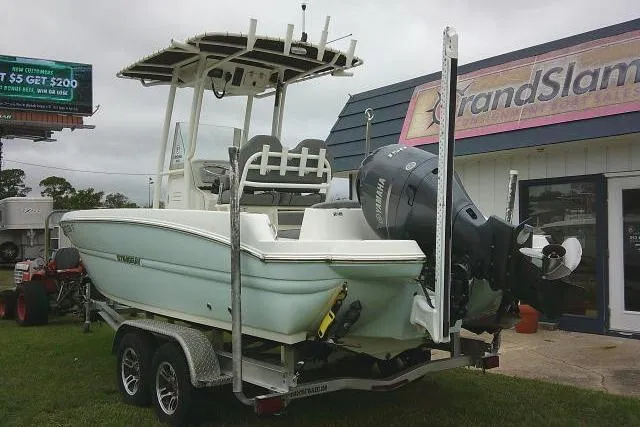 Slide: The Image of 2020 Stingray 216 CC boat on trailer outside dealership. - 2