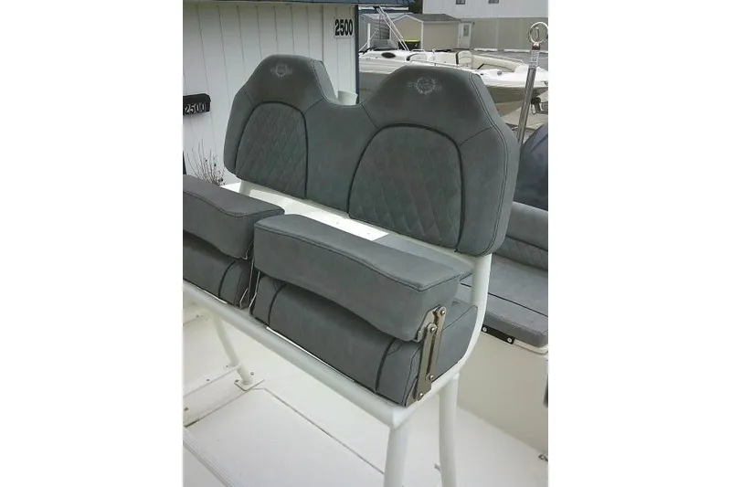 Slide: The Image of 2020 Stingray 216 CC boat seating with gray cushioned upholstery and diamond stitching. - 20