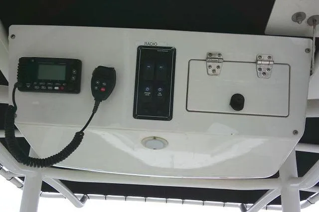 Slide: The Image of 2020 Stingray 216 CC boat console with radio and control panel. - 31