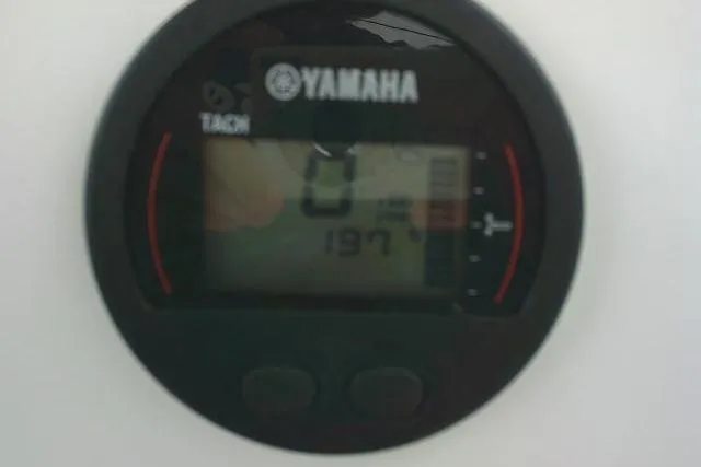 Slide: The Image of Yamaha tachometer display on 2020 Stingray 216 CC boat dashboard. - 36