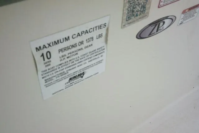 Slide: The Image of 2020 Stingray 216 CC capacity label, maximum 10 persons or 1375 lbs, safety instructions visible. - 38