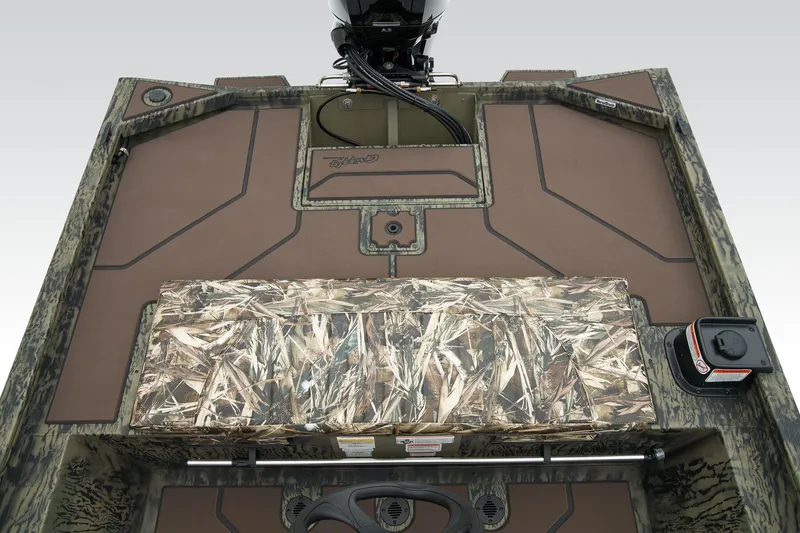 Slide: The Image of Manufacturer Provided Image: 2026 Tracker Grizzly 1860 CC boat interior with camo seating and storage compartments. - 31