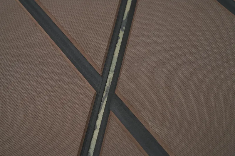 Slide: The Image of Manufacturer Provided Image: Textured surface detail of 2026 Tracker Grizzly 1860 CC boat flooring. - 35