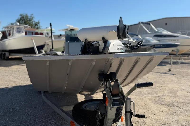 Slide: The Image of 2013 G3 1860 CC Deluxe boat on trailer, with other boats in background. - 12