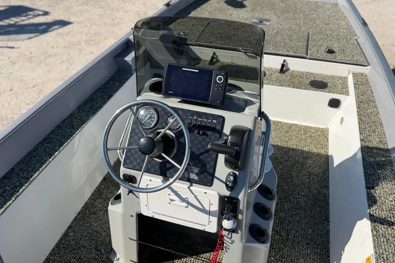 Slide: The Image of 2013 G3 1860 CC Deluxe boat console with steering wheel and navigation system. - 14