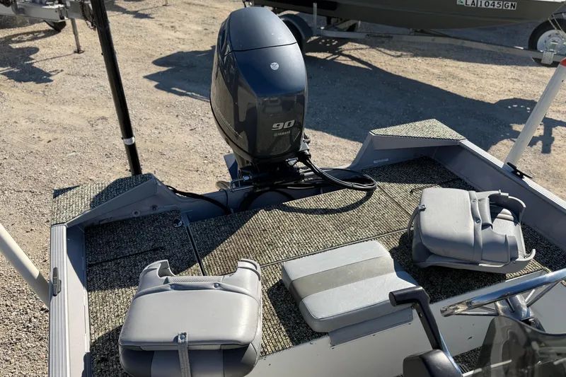 Slide: The Image of 2013 G3 1860 CC Deluxe boat with Yamaha 90 engine and seating on deck. - 16