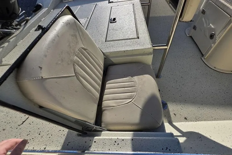 Slide: The Image of 2016 Xpress H20B Bay boat seat with textured upholstery and storage compartment. - 10