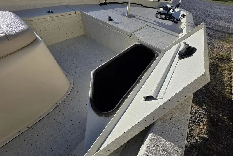 Slide: The Image of 2016 Xpress H20B Bay boat interior with open storage compartment. - 12