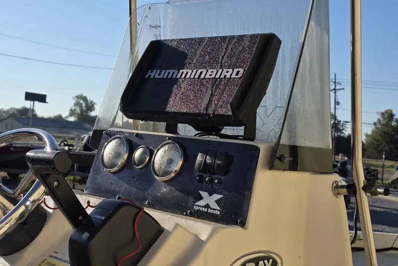 Slide: The Image of Control panel of a 2016 Xpress H20B Bay boat with Humminbird electronics. - 13