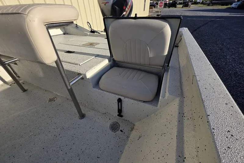 Slide: The Image of 2016 Xpress H20B Bay boat with open storage seat on deck. - 14