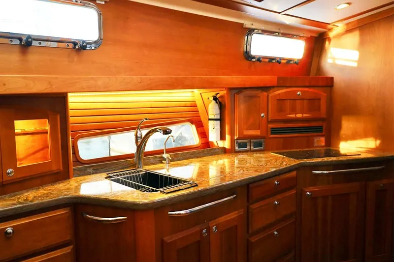 Slide: The Image of Luxurious wooden kitchen interior of 2018 Sabre 48 Flybridge Sedan yacht. - 12
