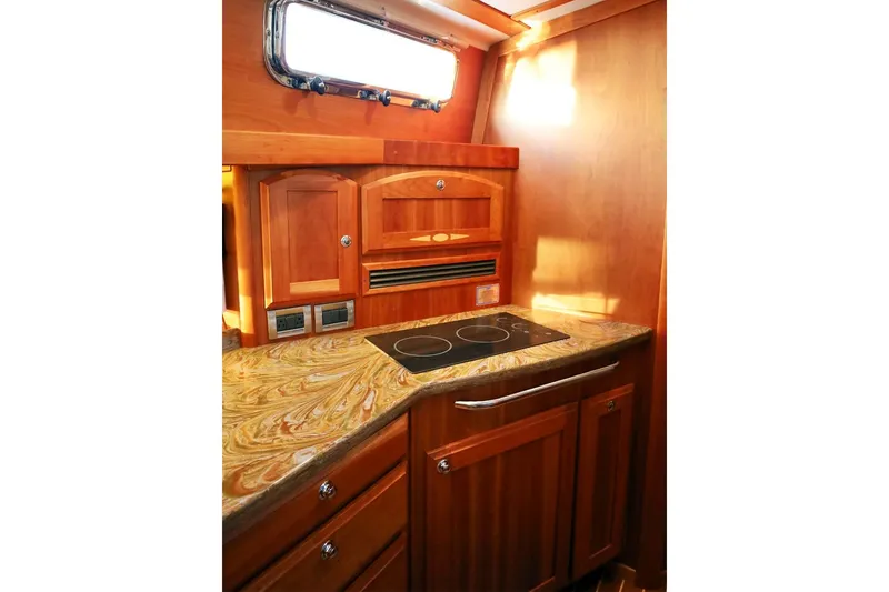 Slide: The Image of Luxurious wooden kitchen interior of 2018 Sabre 48 Flybridge Sedan yacht. - 13