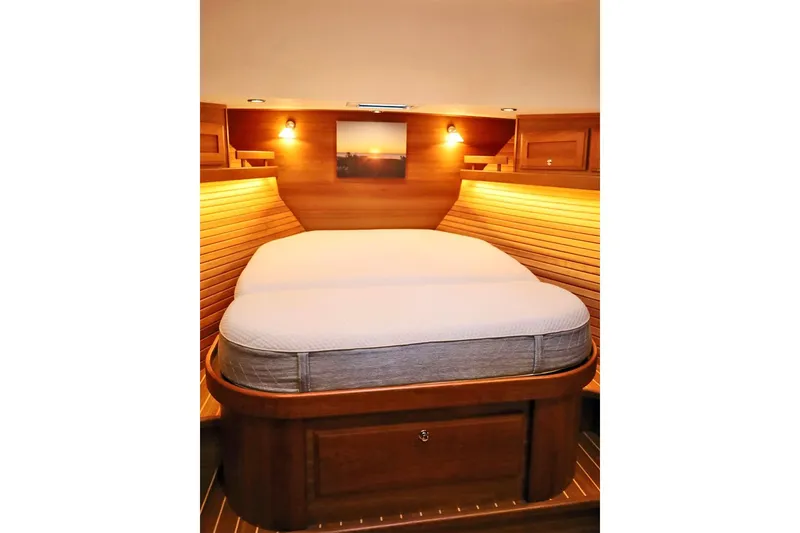 Slide: The Image of Luxurious cabin interior of 2018 Sabre 48 Flybridge Sedan yacht with cozy bed. - 21