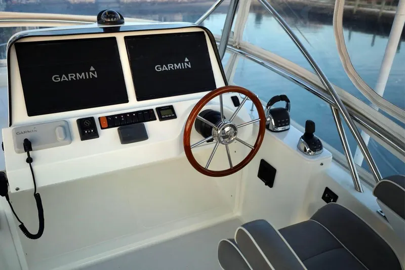 Slide: The Image of Helm of 2018 Sabre 48 Flybridge Sedan with Garmin navigation displays. - 7