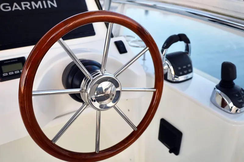 Slide: The Image of Steering wheel of 2018 Sabre 48 Flybridge Sedan yacht with Garmin navigation. - 8