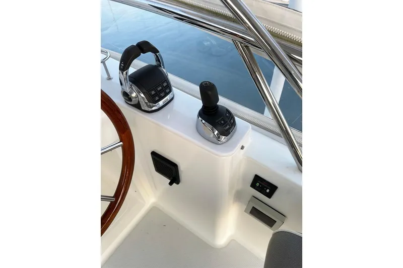 Slide: The Image of Control panel of 2018 Sabre 48 Flybridge Sedan with throttle and joystick. - 9