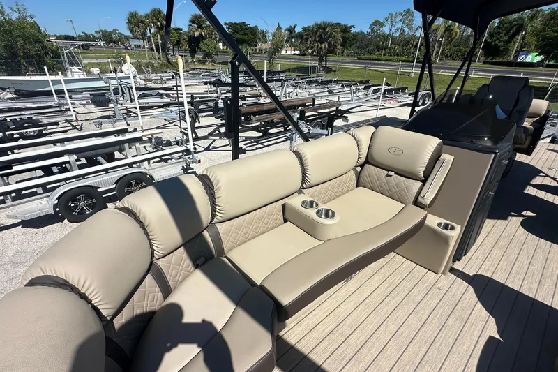 Slide: The Image of 2024 Veranda VP 25RC pontoon boat with luxurious seating and cup holders. - 6