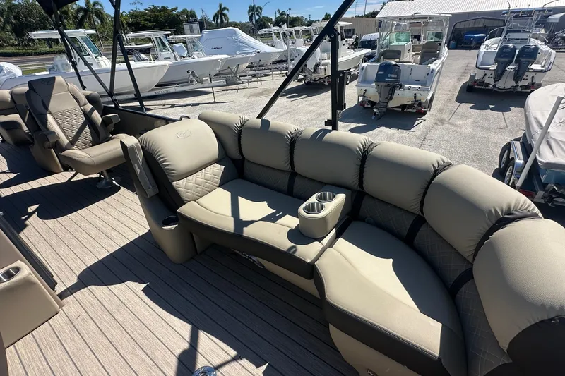 Slide: The Image of Luxurious seating on 2024 Veranda VP 25RC pontoon boat, with cup holders and elegant design. - 8