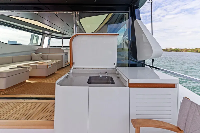 Slide: The Image of Luxury interior of 2020 Mangusta 109 yacht with outdoor sink and seating area. - 10
