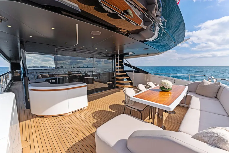 Slide: The Image of Luxurious deck of 2020 Mangusta 109 yacht with ocean view and elegant seating area. - 19