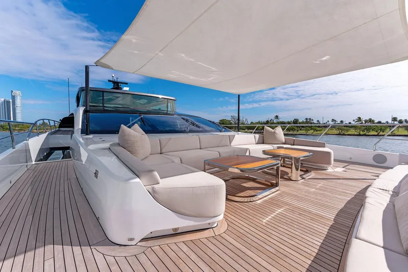 Slide: The Image of Luxurious 2020 Mangusta 109 yacht deck with modern seating and sunshade. - 23