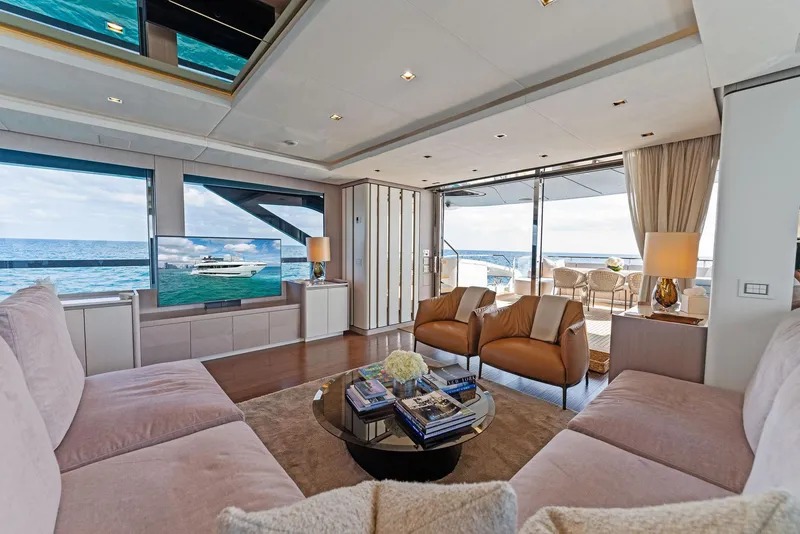 Slide: The Image of Luxurious interior of 2020 Mangusta 109 yacht with ocean view, plush seating, and modern decor. - 31