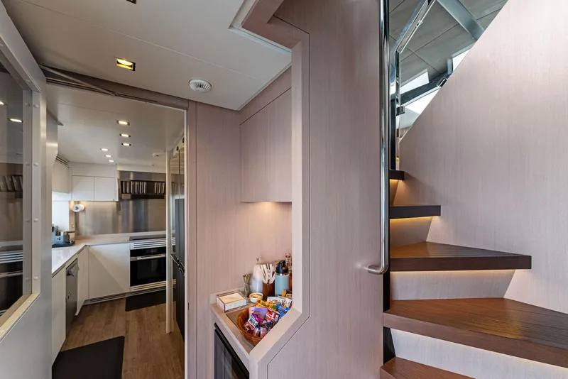 Slide: The Image of Modern interior of 2020 Mangusta 109 yacht with kitchen and staircase. - 35