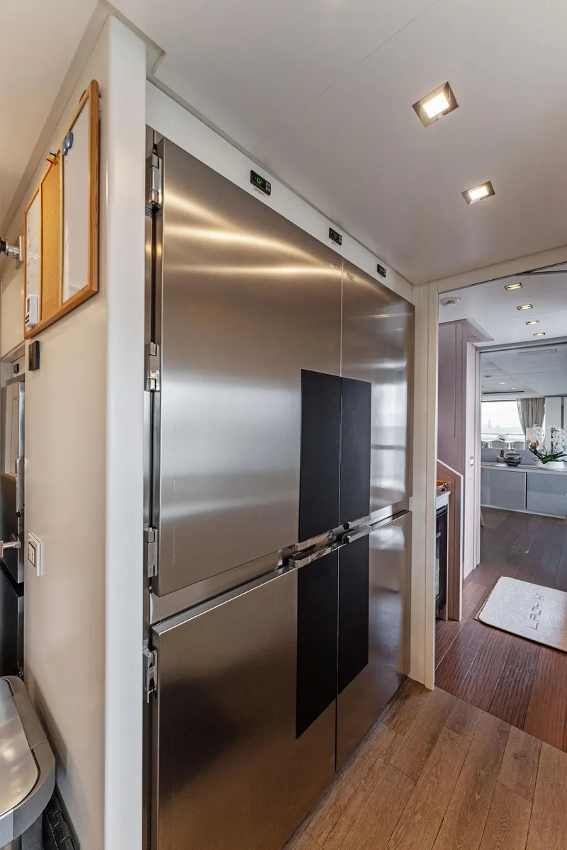 Slide: The Image of Modern kitchen area in a 2020 Mangusta 109 yacht with stainless steel appliances. - 38