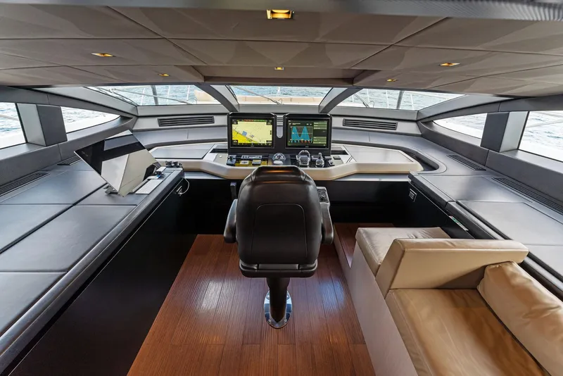 Slide: The Image of Modern Mangusta 109 yacht cockpit with advanced navigation systems, leather seating, and panoramic windows, 2020 model. - 41