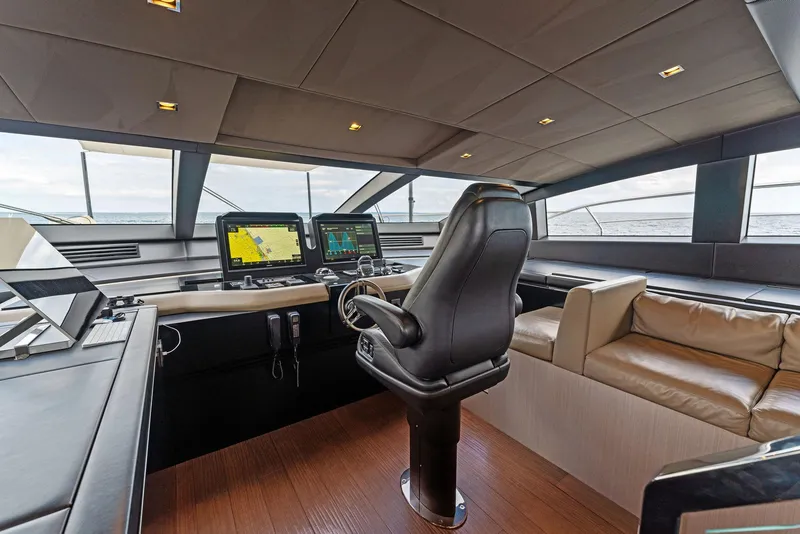 Slide: The Image of Mangusta 109 2020 yacht cockpit with modern navigation systems and luxurious seating. - 43