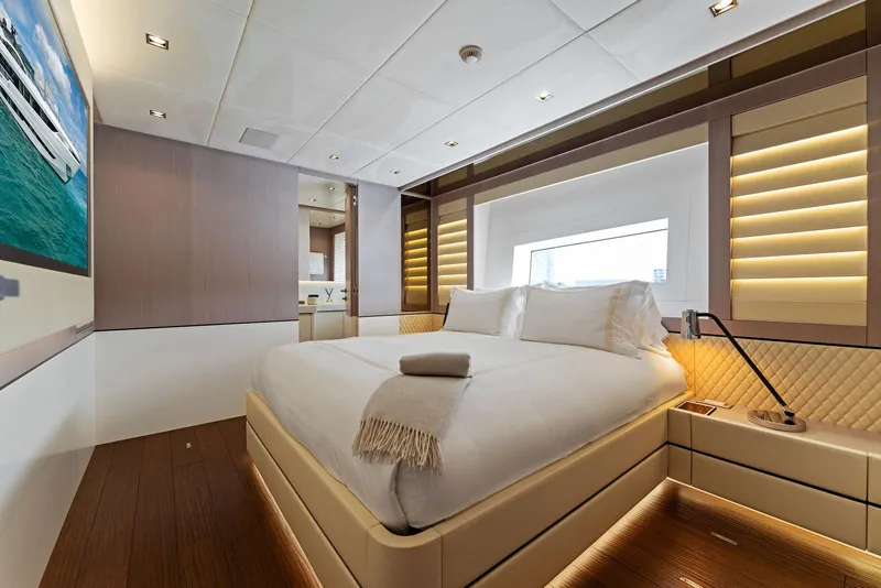 Slide: The Image of Luxurious bedroom on a 2020 Mangusta 109 yacht with modern decor and ocean view. - 45
