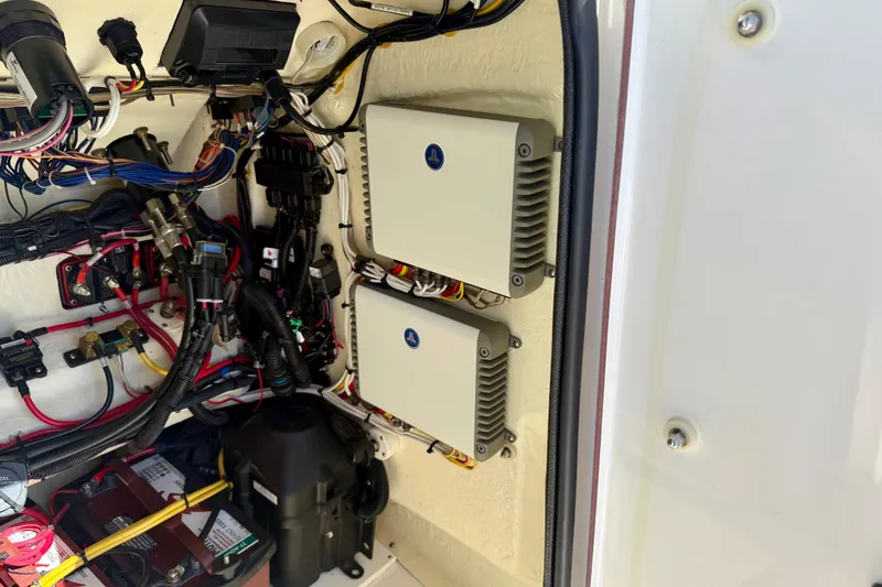Slide: The Image of Electrical wiring and components inside a 2021 BlackJack 256 Bay boat. - 21
