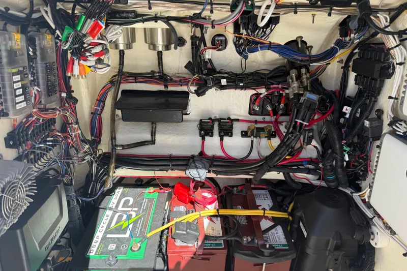 Slide: The Image of Electrical system of a 2021 BlackJack 256 Bay boat, featuring batteries and wiring. - 22