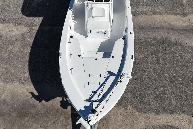 Slide: The Image of Top view of a 2021 BlackJack 256 Bay boat on a concrete surface. - 5