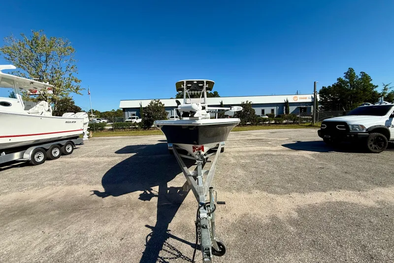 Slide: The Image of 2021 BlackJack 256 Bay boat on trailer in sunny outdoor setting. - 8