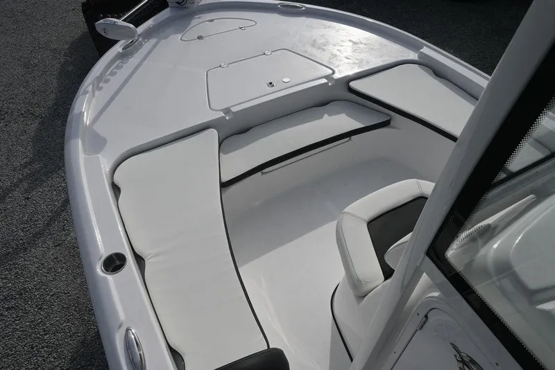 Slide: The Image of 2026 Tidewater 2210 Carolina Bay boat interior with cushioned seating and storage compartments. - 10