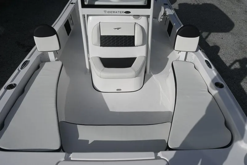 Slide: The Image of 2026 Tidewater 2210 Carolina Bay boat interior with cushioned seating and sleek design. - 16
