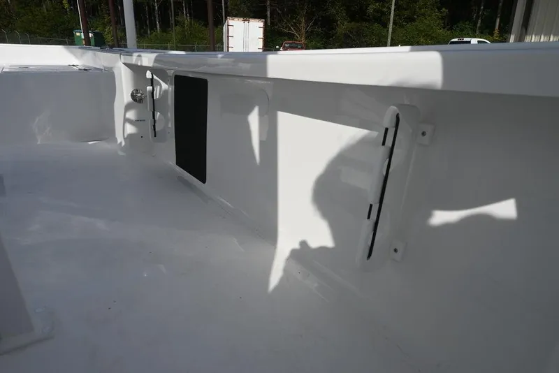Slide: The Image of Interior view of 2026 Tidewater 2210 Carolina Bay boat, showcasing sleek white design. - 17
