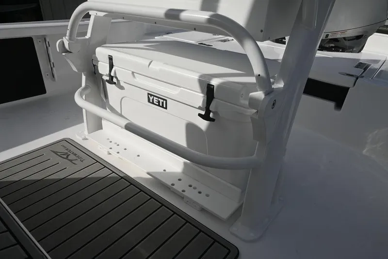 Slide: The Image of 2026 Tidewater 2210 Carolina Bay boat with Yeti cooler and non-slip deck mat. - 18