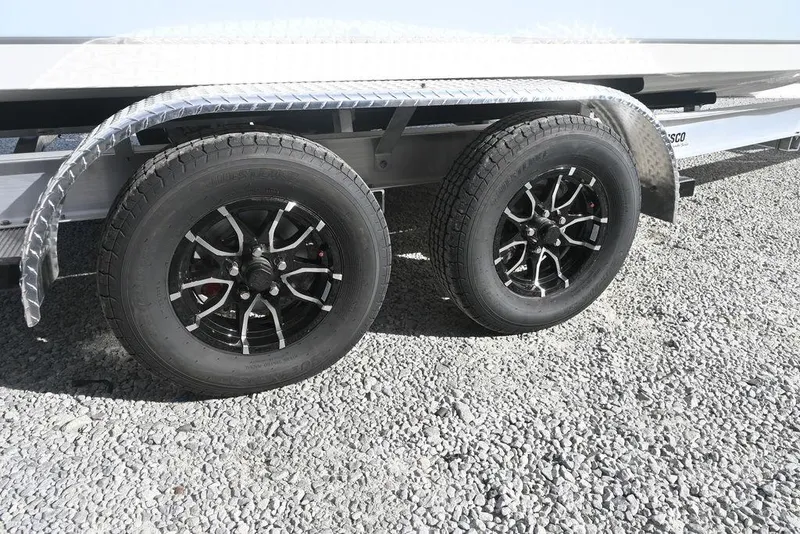 Slide: The Image of Trailer wheels of 2026 Tidewater 2210 Carolina Bay on gravel surface. - 24