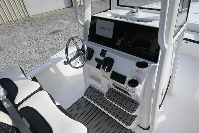 Slide: The Image of 2026 Tidewater 2210 Carolina Bay boat console with Garmin navigation system and seating. - 5