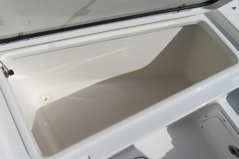 Slide: The Image of Open storage compartment on 2020 Sea Hunt Ultra 255 SE boat. - 12
