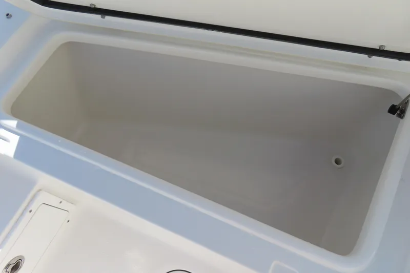 Slide: The Image of Open storage compartment on 2020 Sea Hunt Ultra 255 SE boat. - 13