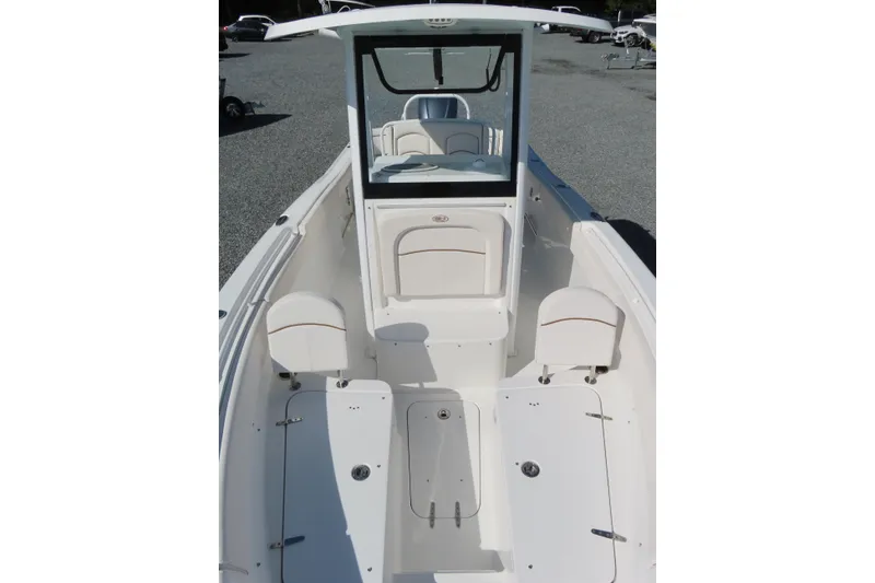 Slide: The Image of 2020 Sea Hunt Ultra 255 SE boat interior with seating and storage compartments. - 16