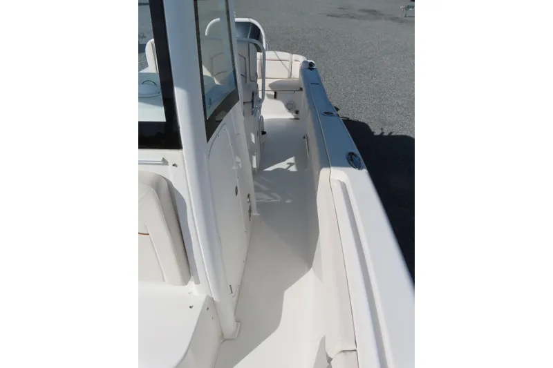 Slide: The Image of 2020 Sea Hunt Ultra 255 SE boat interior, featuring sleek white deck and seating. - 18