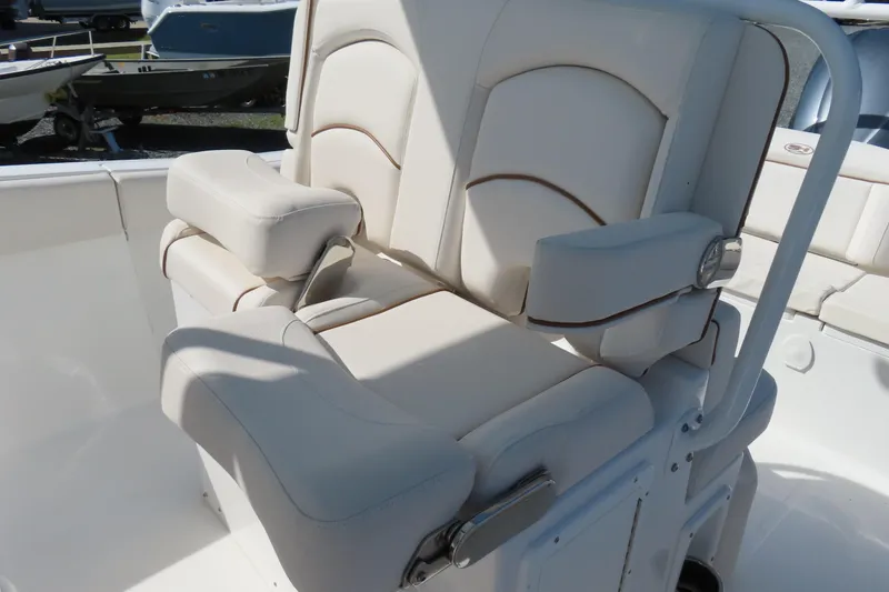 Slide: The Image of Luxurious seating on 2020 Sea Hunt Ultra 255 SE boat, featuring plush white upholstery. - 22