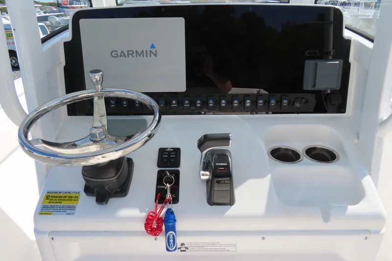 Slide: The Image of 2020 Sea Hunt Ultra 255 SE helm with Garmin display and Yamaha controls. - 23