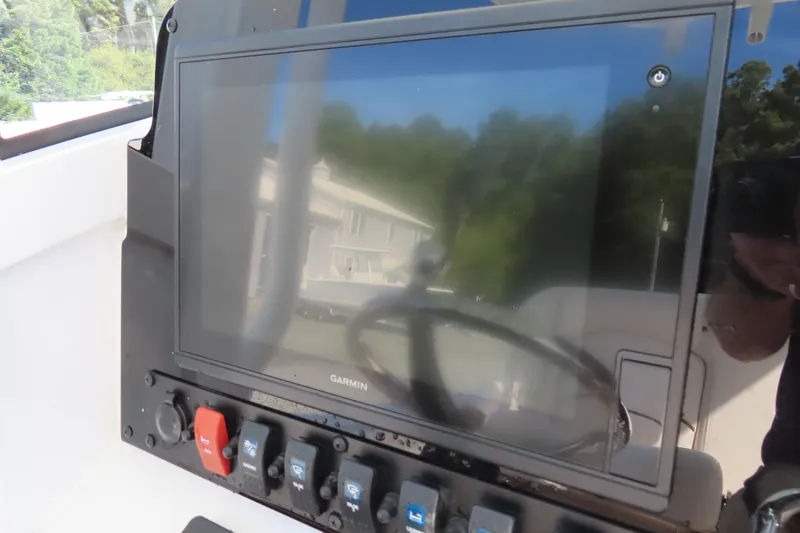 Slide: The Image of Garmin display on 2020 Sea Hunt Ultra 255 SE boat dashboard. - 24