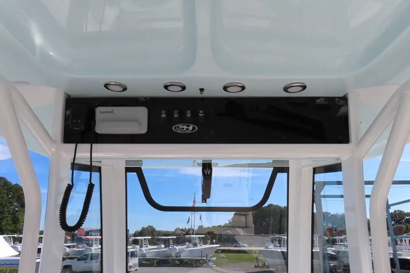 Slide: The Image of 2020 Sea Hunt Ultra 255 SE boat console with Garmin electronics and overhead lighting. - 27